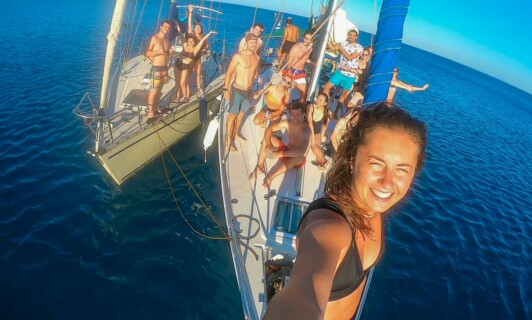 sailing boats with stay tourists on favourite amazing sunset sailing activity