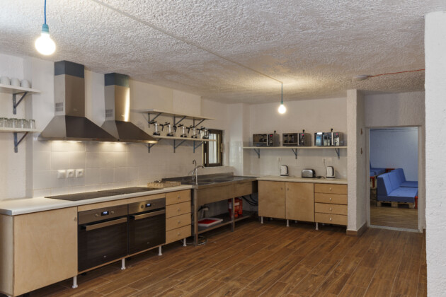 big shared kitchen for guests in common areas stay hostel rhodes
