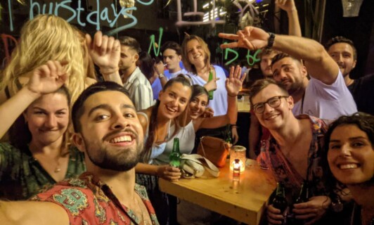 happy travellers going out together exploring nightlife and best bars in rhodes